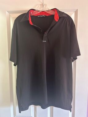 Travis Mathew Black Polo with Red Collar Accent